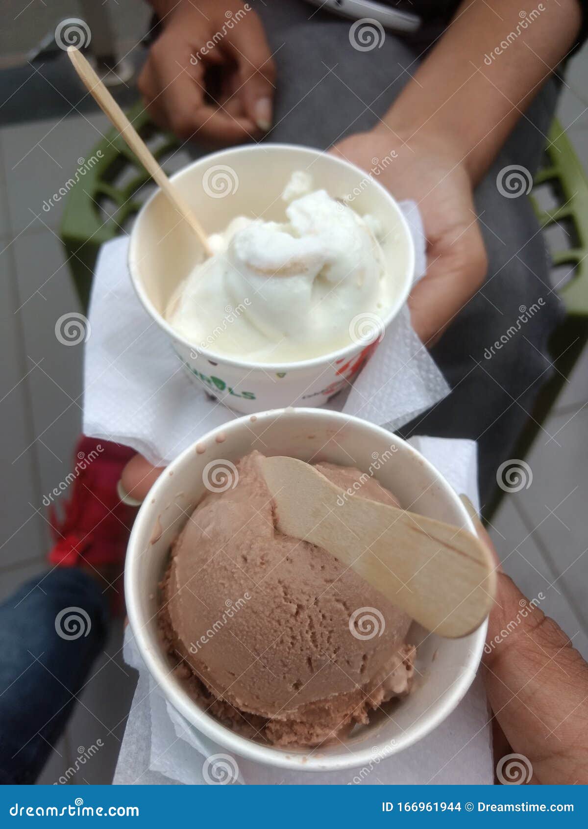 ice-cream-cups-spoons-couple-chocolate-ice-cream-vanilla-ice-cream-couplelove-spoonchairstissue-paper-two-hands-166961944.jpg