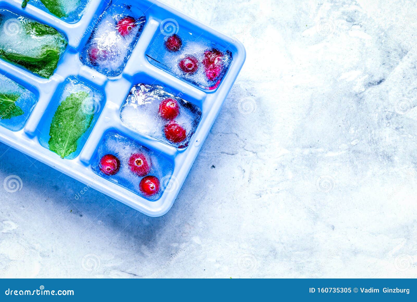 Download Ice Cubes With Berries And Mint Stone Background Top View ...