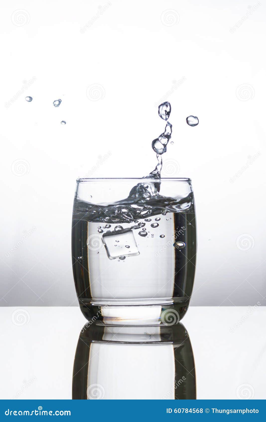 Ice Dropping into a Glass of Water Stock Photo Image of splashing