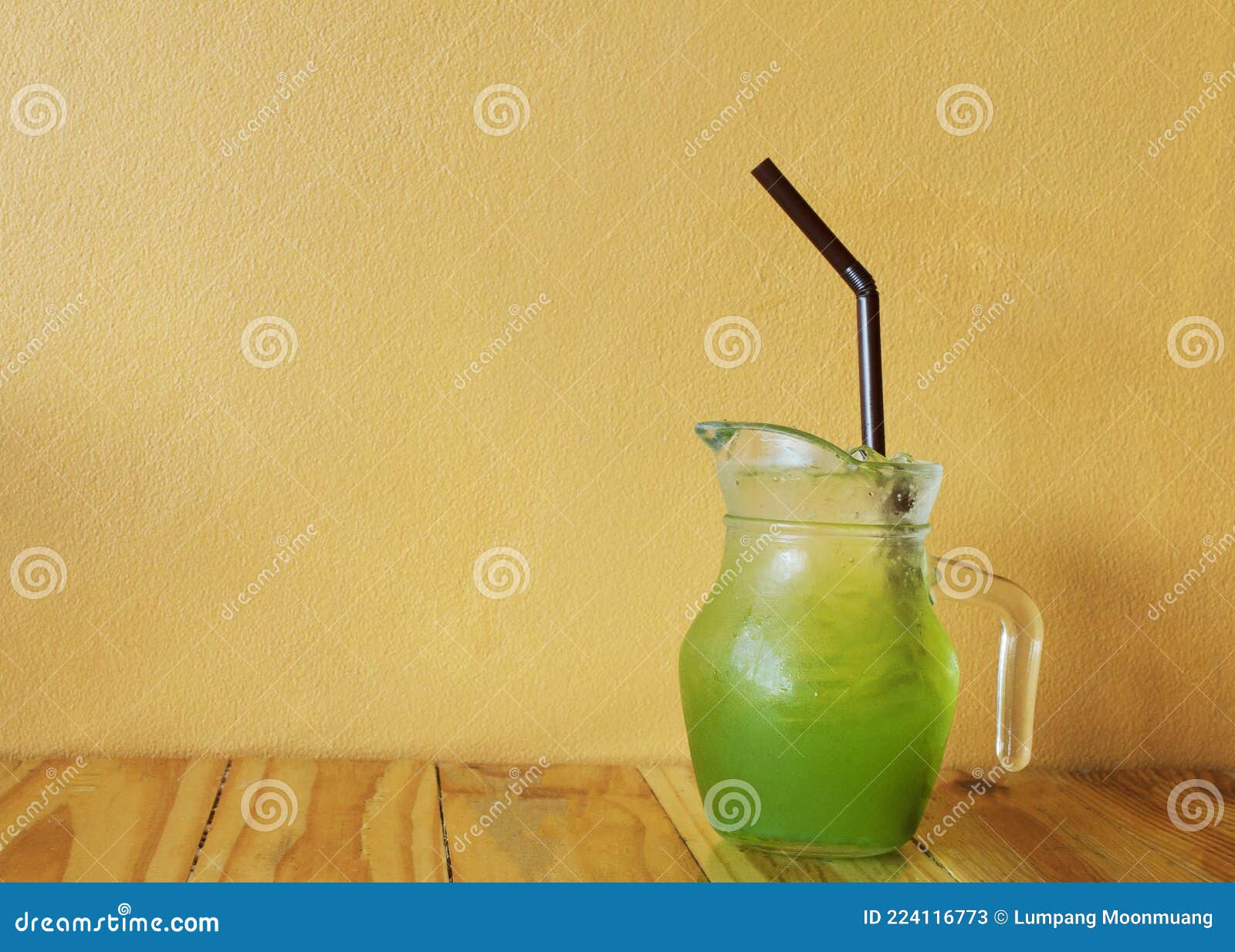 Ice Green Tea in Jug on Wooden Table with Copy Space Stock Image