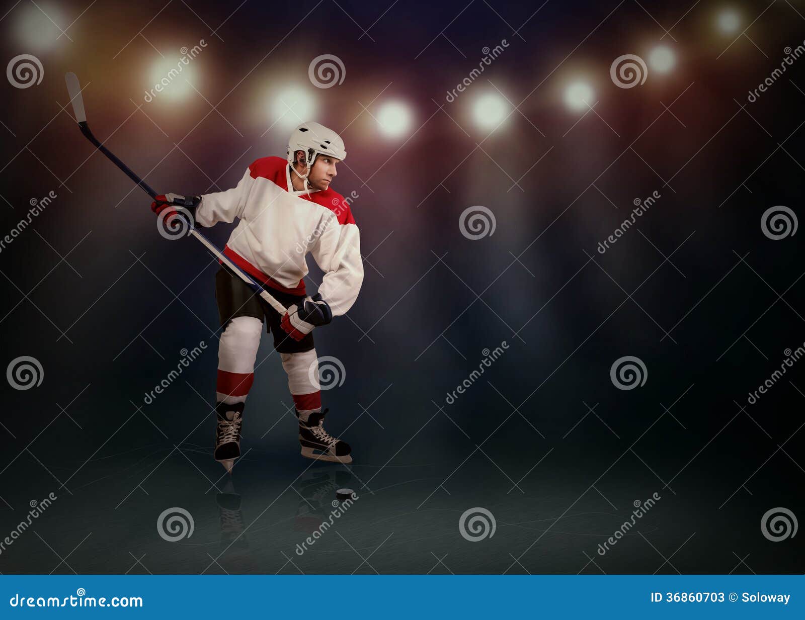 ice hockey player ready to make a snapshot