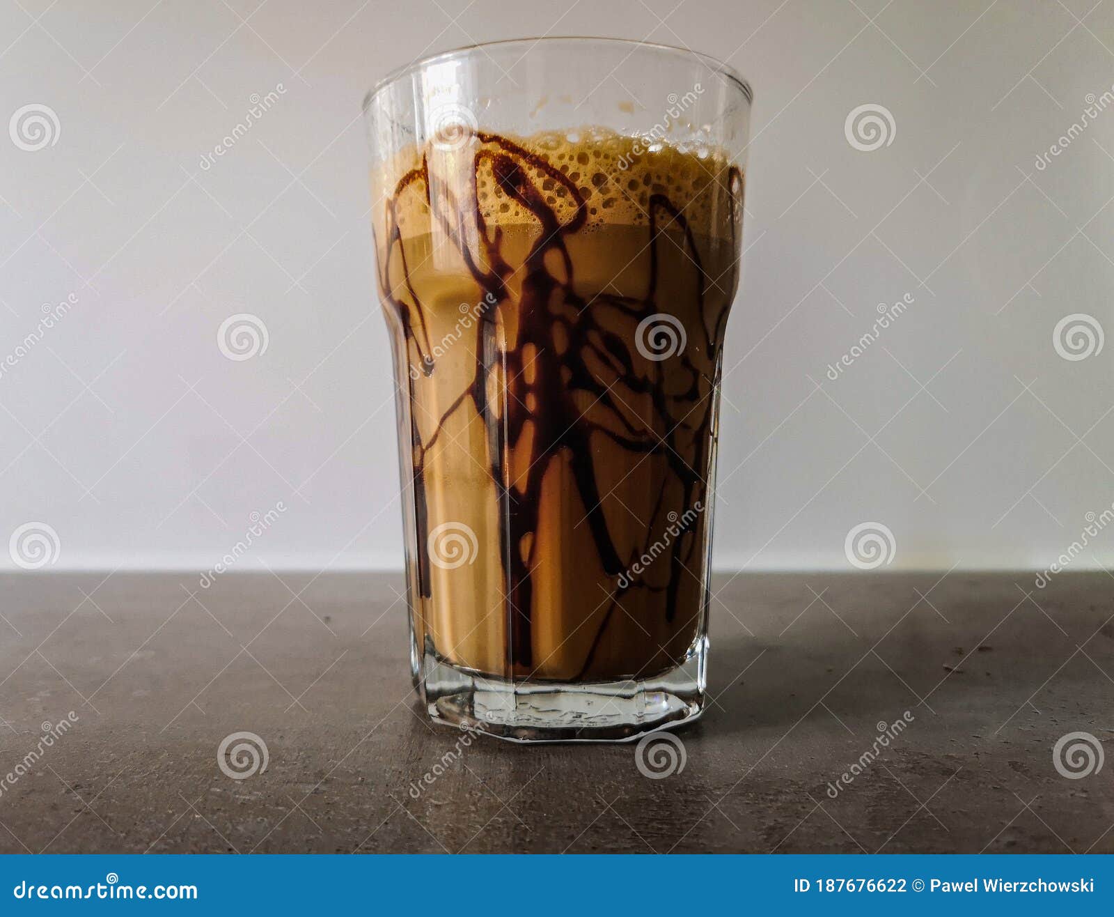 ice shaked coffee with chocolate souce on glass
