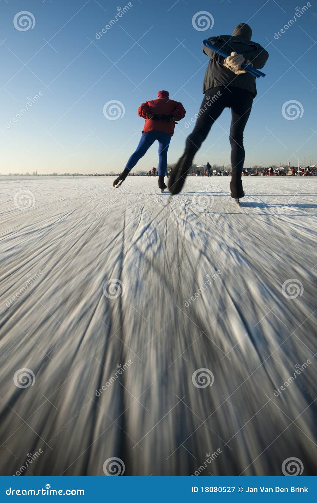 ice skaters on a frozen lake.