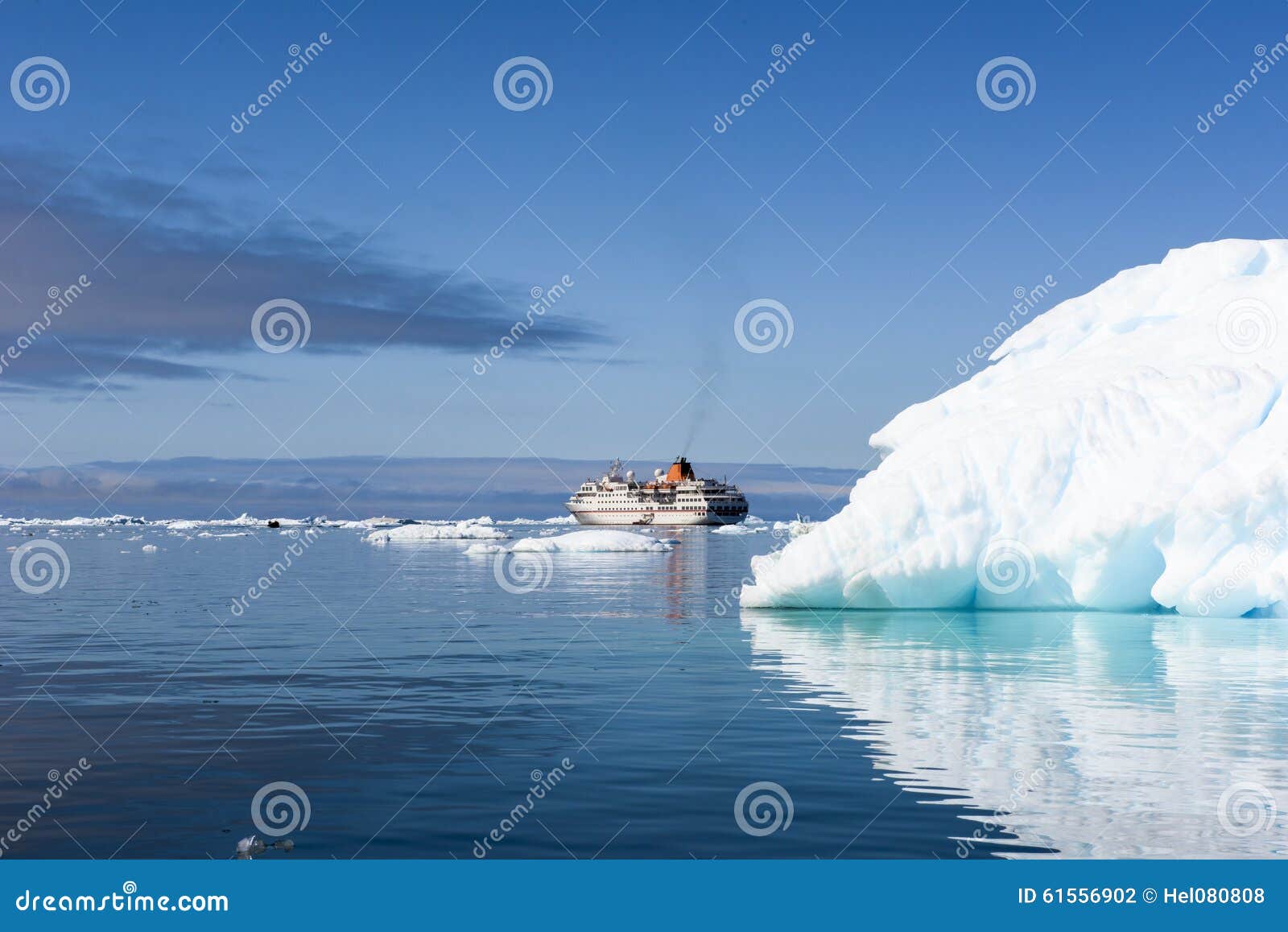 Huge Iceberg, with Beautiful Reflection in Arctic Ocean and Small