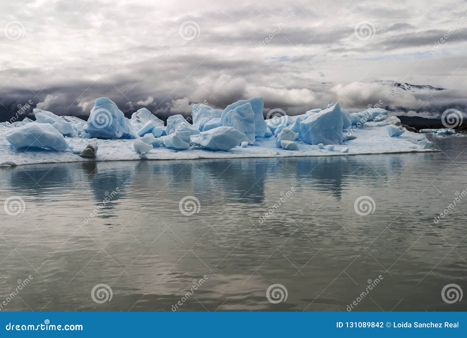 Iceberg Island with Large Blocks of Ice Floating in the Water Stock