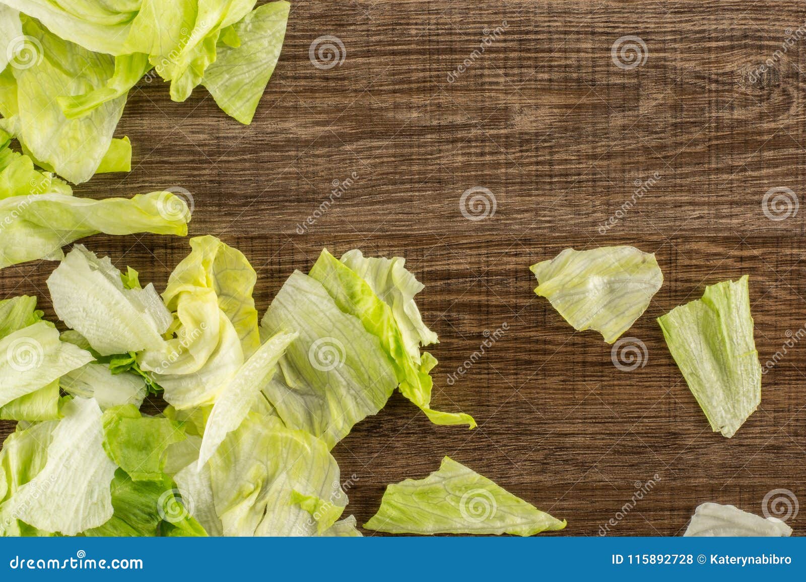 Fresh raw Iceberg Lettuce on brown wood. Iceberg lettuce table top isolated on brown wood background fresh torn salad leaves stack