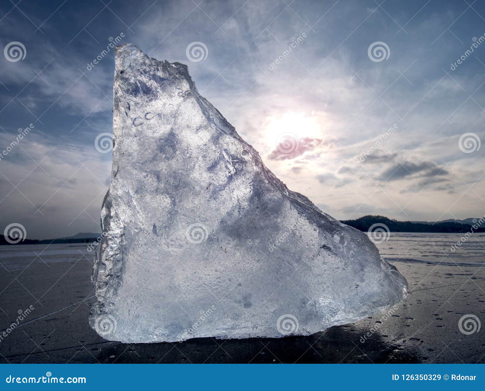 Iceberg Piece in the Snow Floe Floating in Open Ocean. Pink Sunset ...