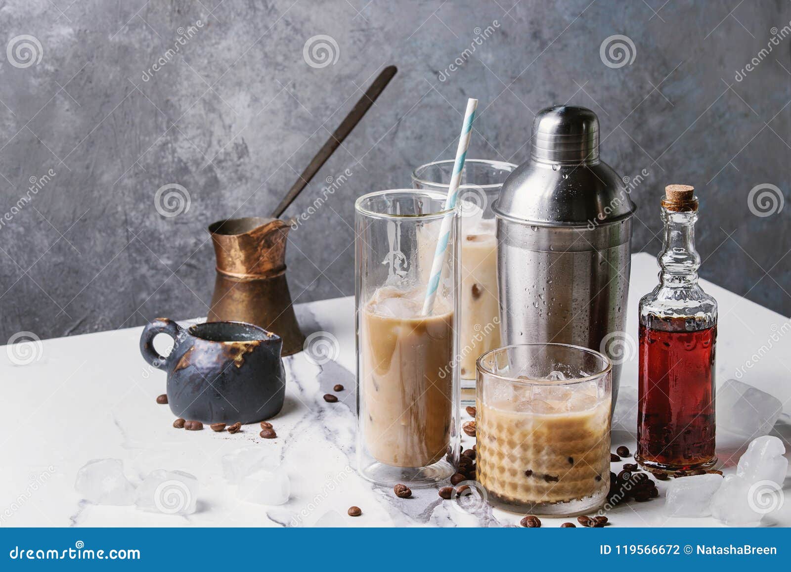 https://thumbs.dreamstime.com/z/iced-coffee-cocktail-frappe-ice-cubes-cream-different-glasses-jezva-silver-shaker-bottle-rum-coffee-beans-119566672.jpg