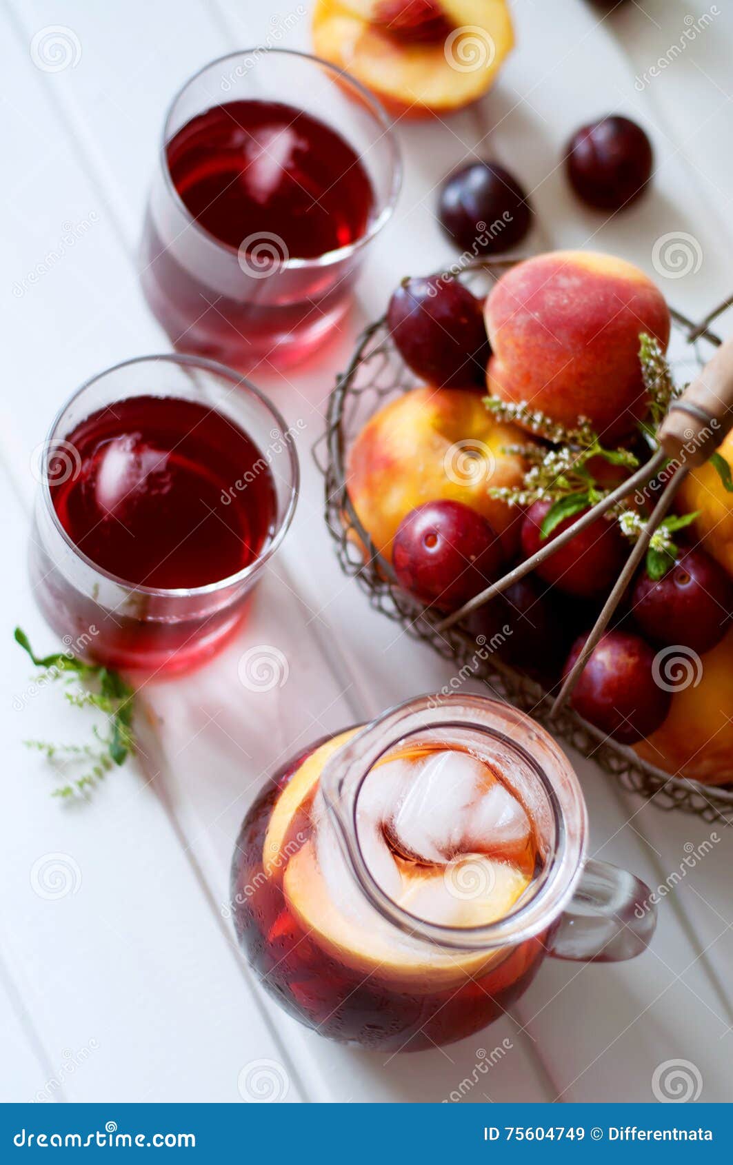 Iced Fruit Compote with Peaches and Plums. Cold Summer Drink. Stock