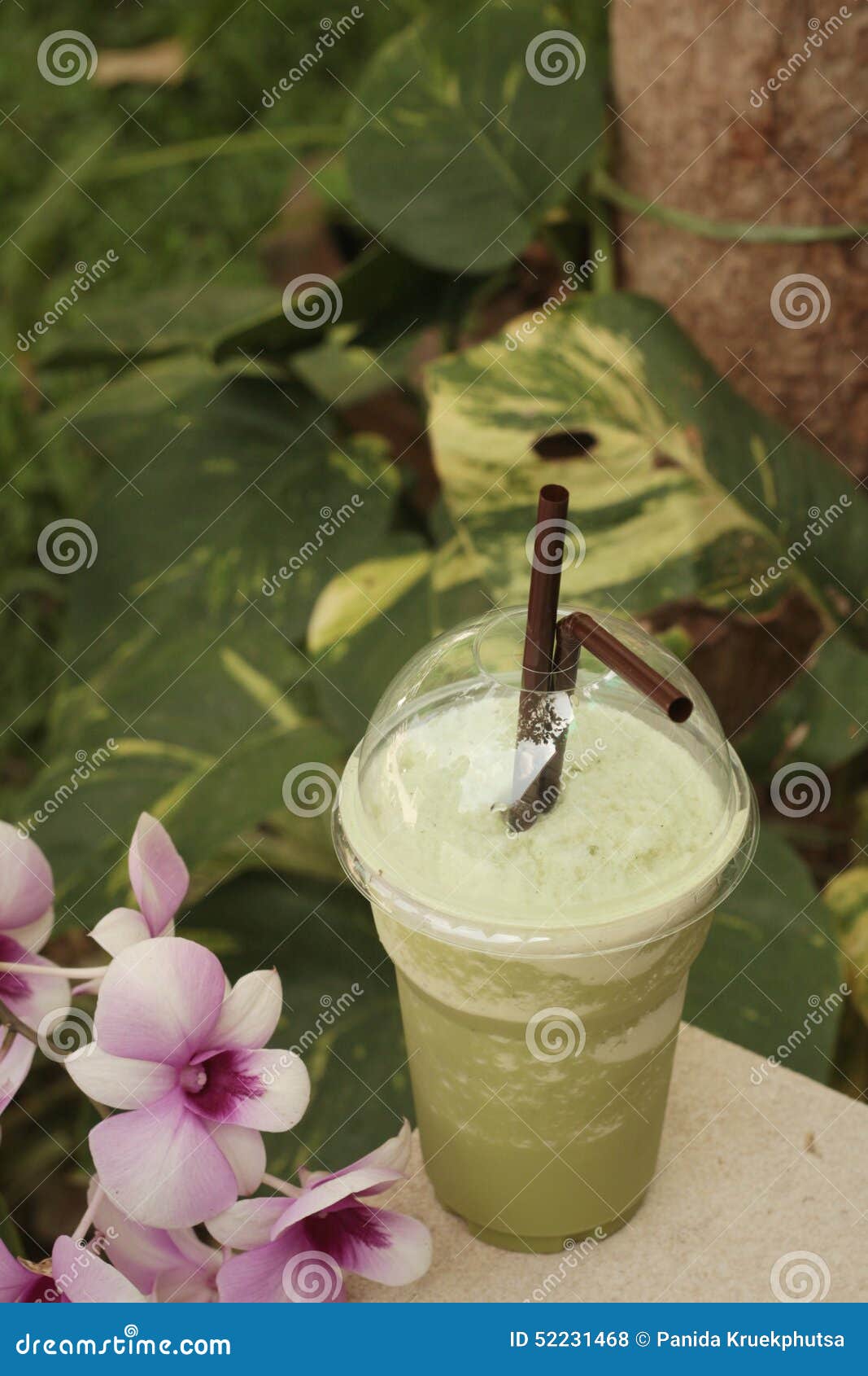 Iced Green Tea with Flowers in the Garden. Stock Photo Image of