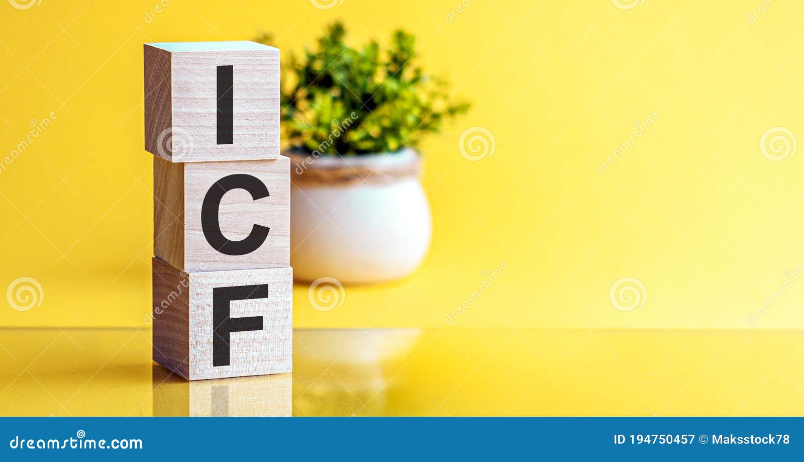 icf - international coach federation - concept, cube wooden block with alphabet combine abbreviation icf. bright yellow background