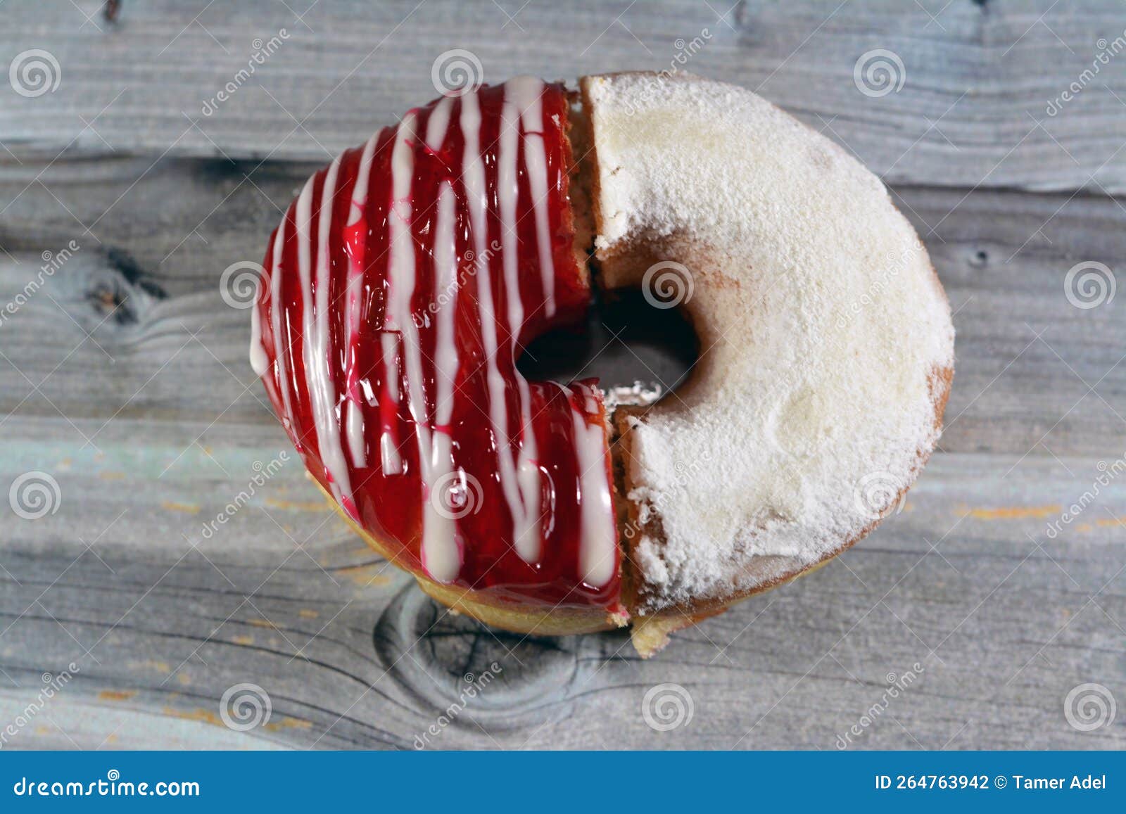 Icing powdered confectioners sugar and strawberry flavored ring donut