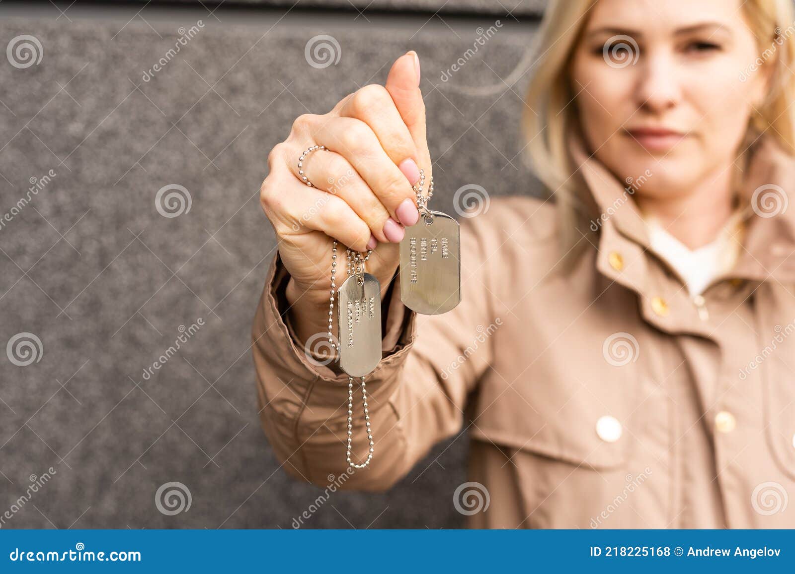 Identification Badges, Woman Holding an Army Badge Stock Photo Image