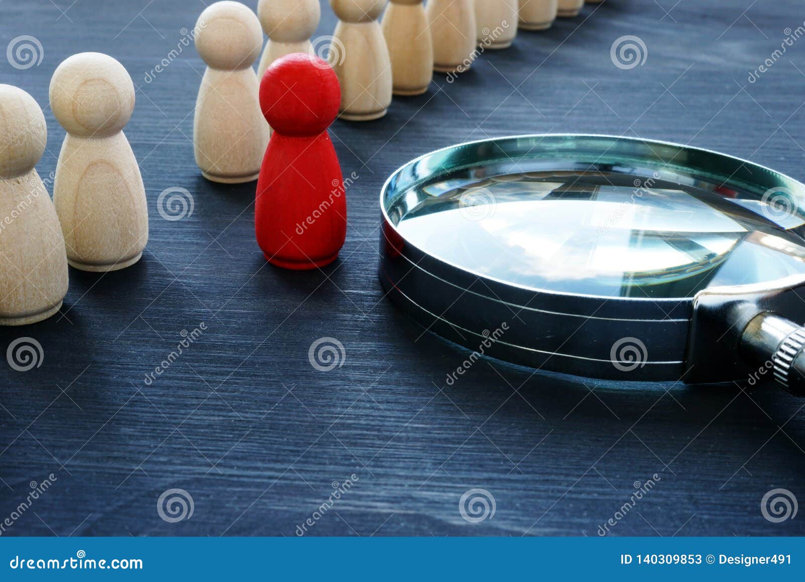 identify concept. recruitment and talent management. red figurine and magnifier