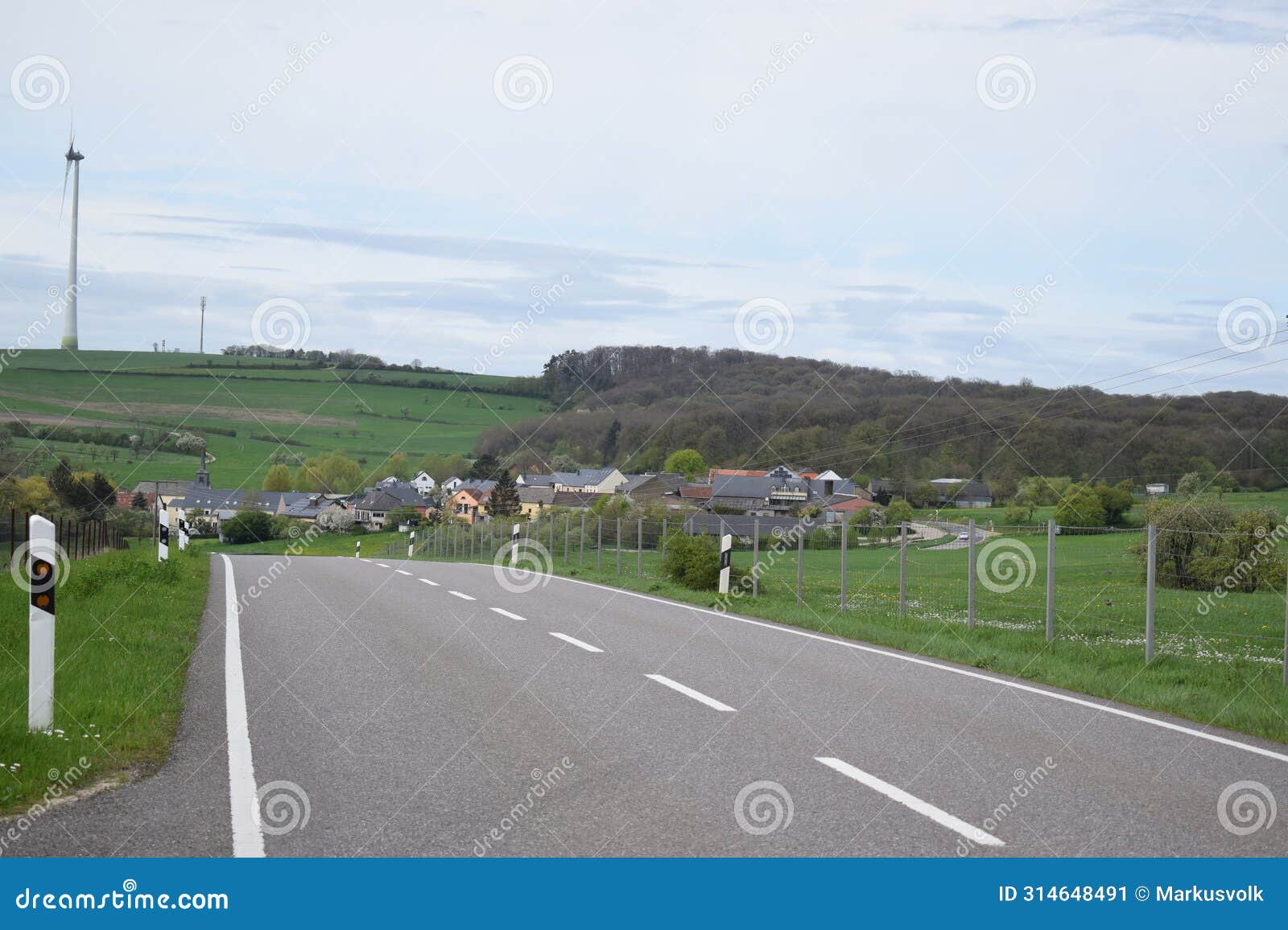 idyllic country road in village mompach, luxembourg