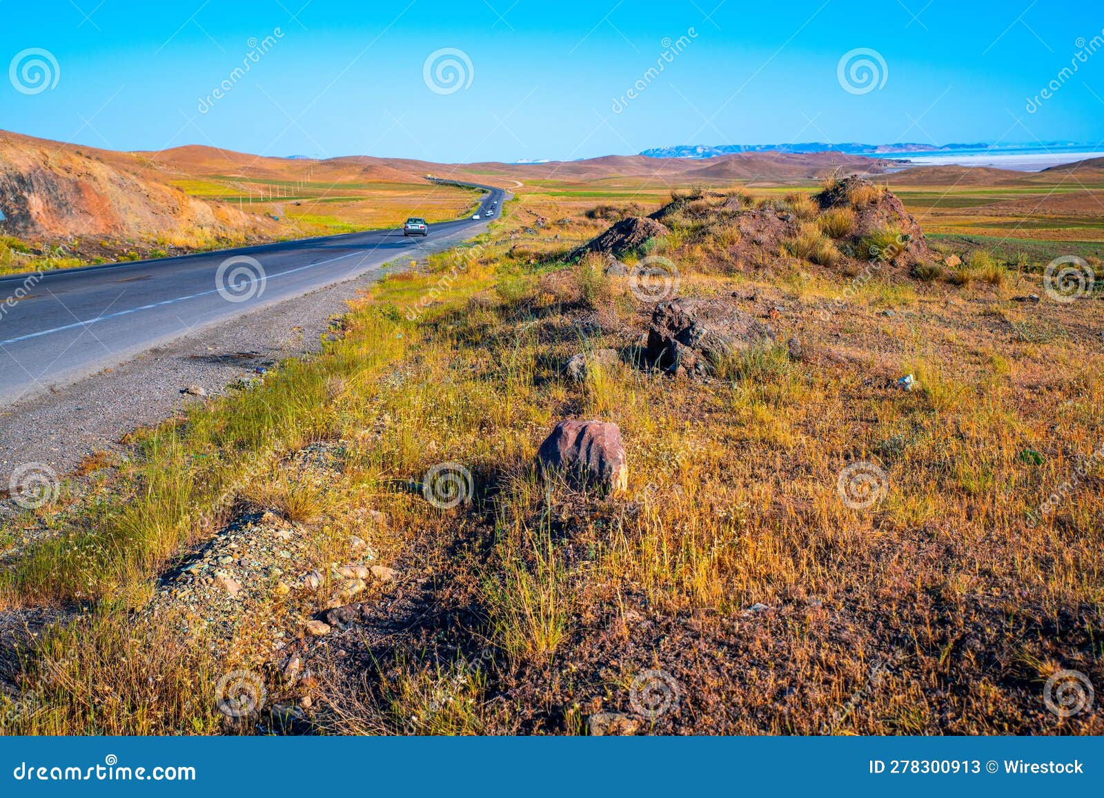 idyllic rural landscape against a vibrant blue sky in town of takab, west azerbaijan province, iran