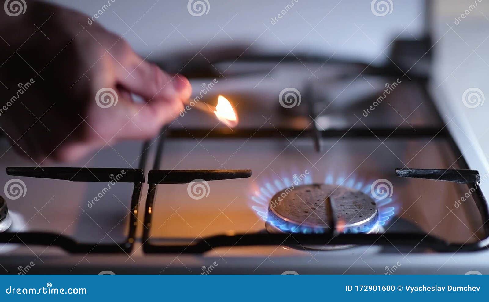 Ignition of a Gas Stove, Closeup. Igniting a Match and Igniting Gas