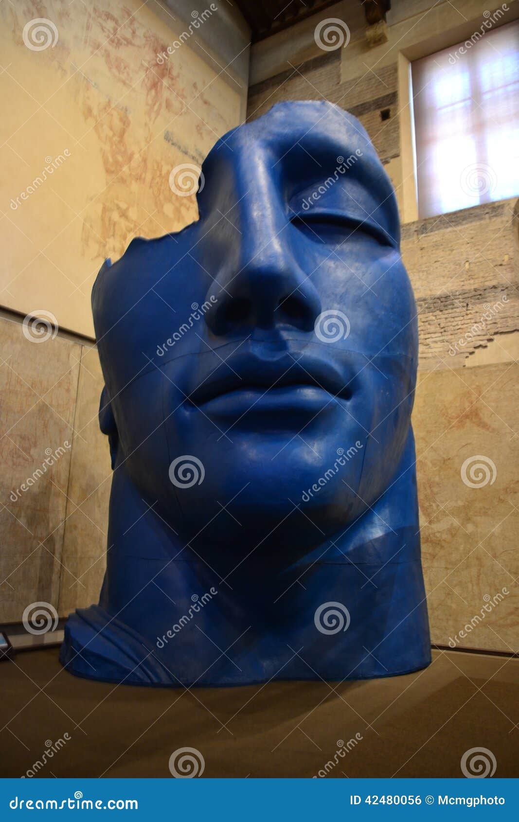 Igor Mitoraj, blue face. Igor Mitorak sculpture, exhibited at museo delle Sinopie at Pisa. Summer 2014