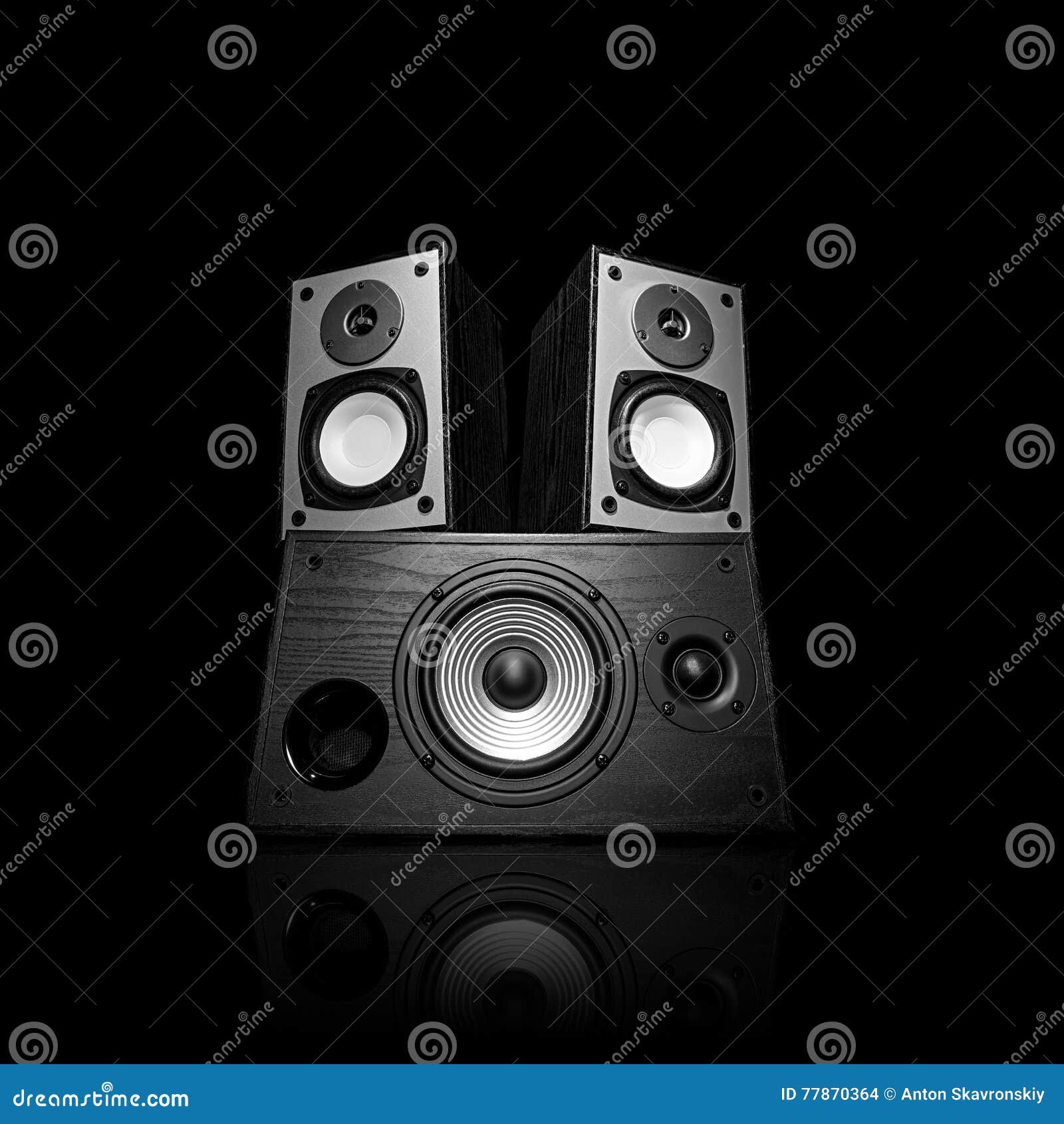 iimage of three audio speakers,  on black.