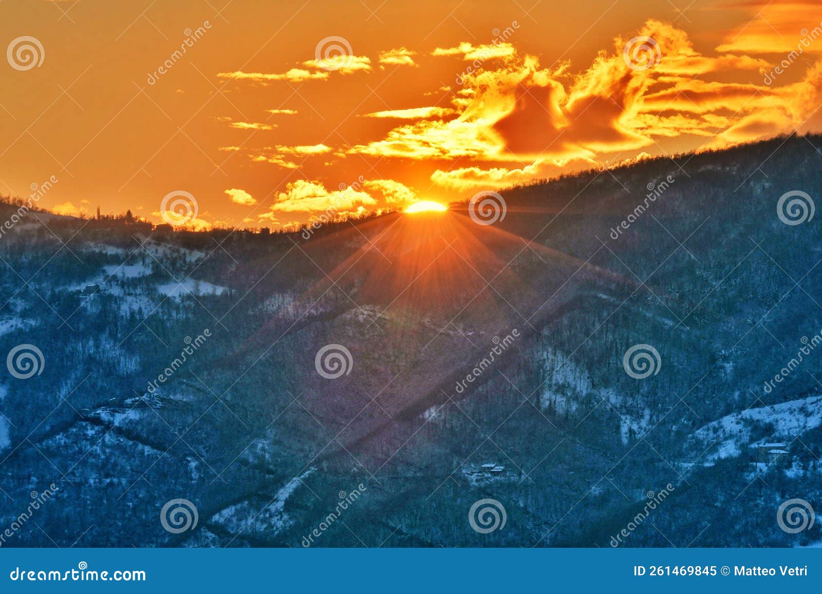 winter sunset on the snowy hills