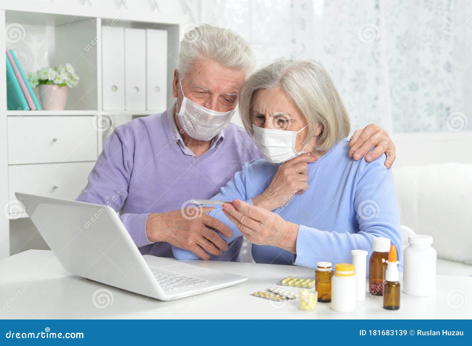 Ill Senior Couple with Facial Masks Using Laptop Stock Image - Image of ...