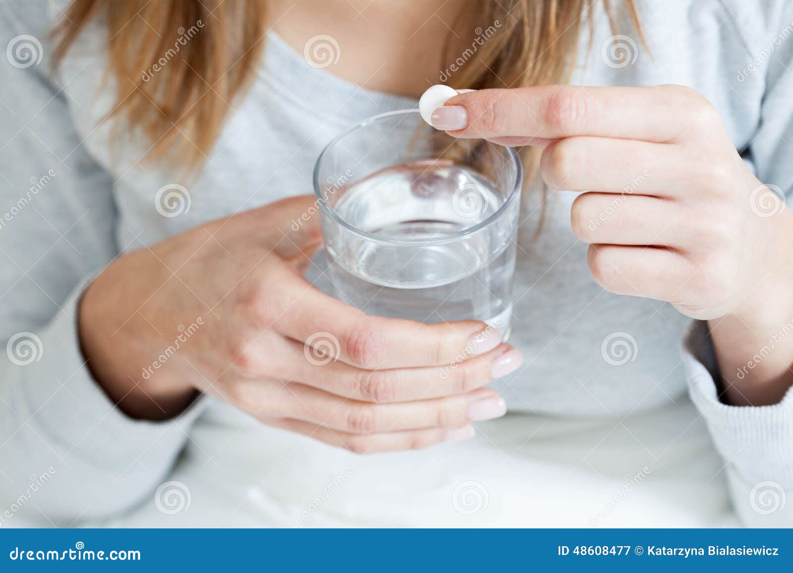 Ill woman taking aspirin stock image. Image of fever 48608477
