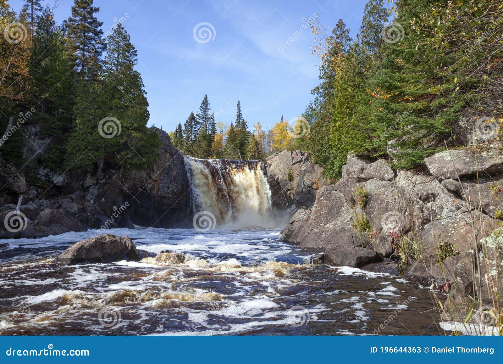 waterfall on a river 0n the north shore of minnesota during autumn