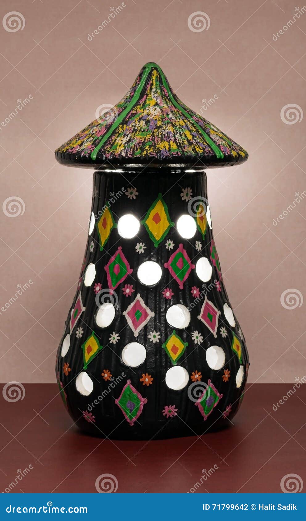 illuminated black painted pottery table lamp