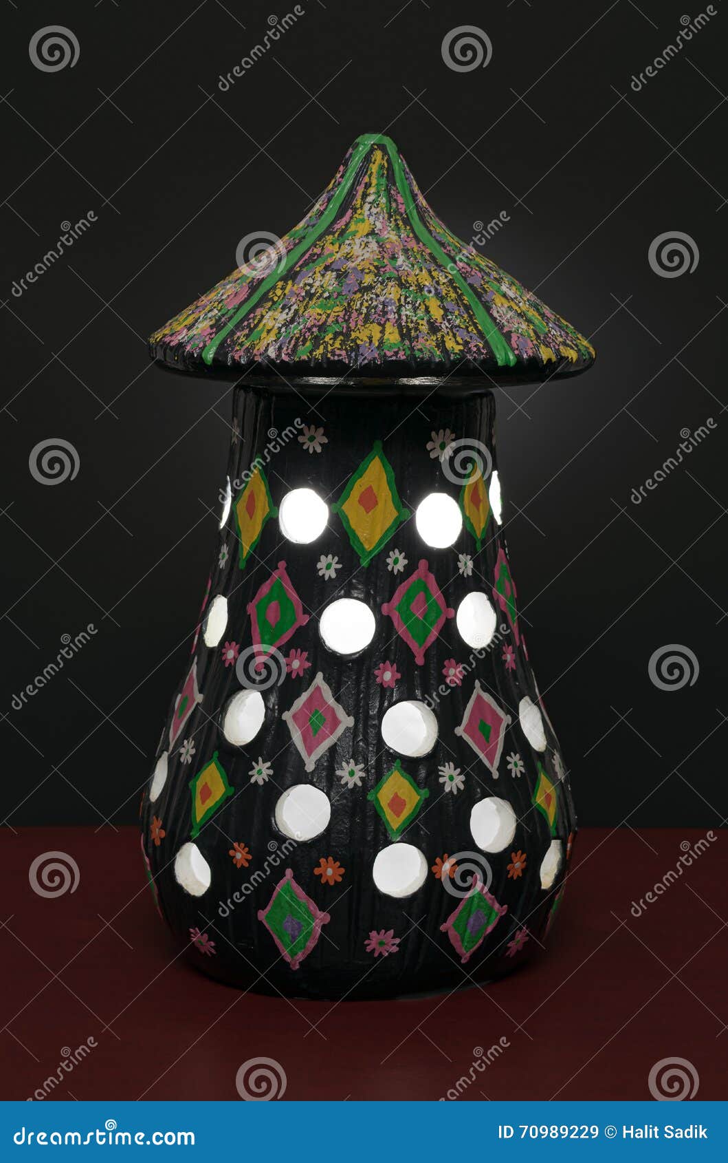 illuminated black painted pottery table lamp