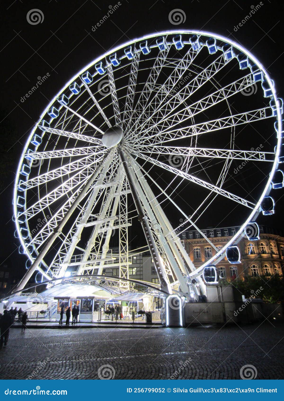 illuminated fairground wheel on a cold night