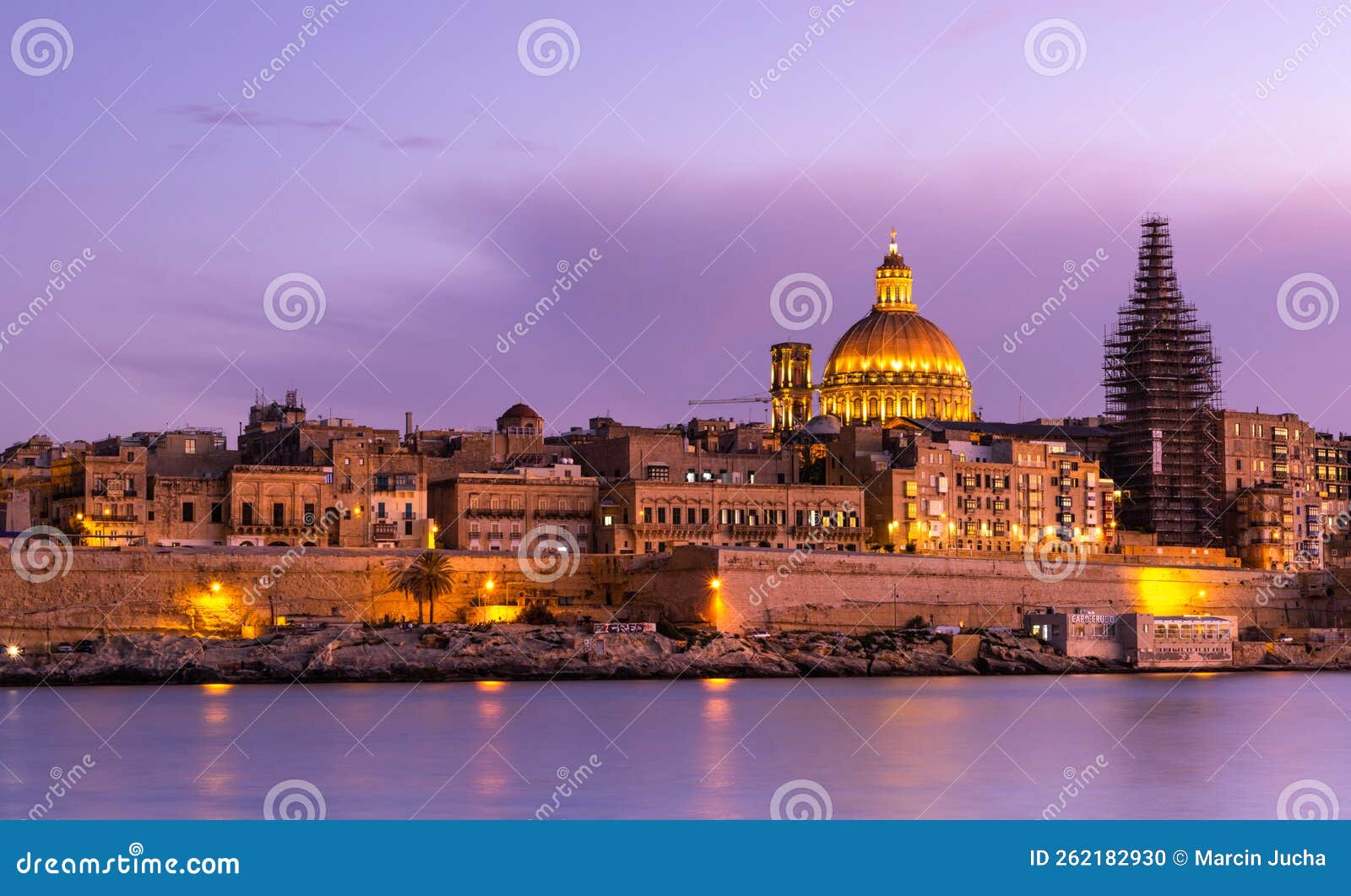 Illuminated Skyline of Valletta Capitol of Malta at Sunset Stock Photo