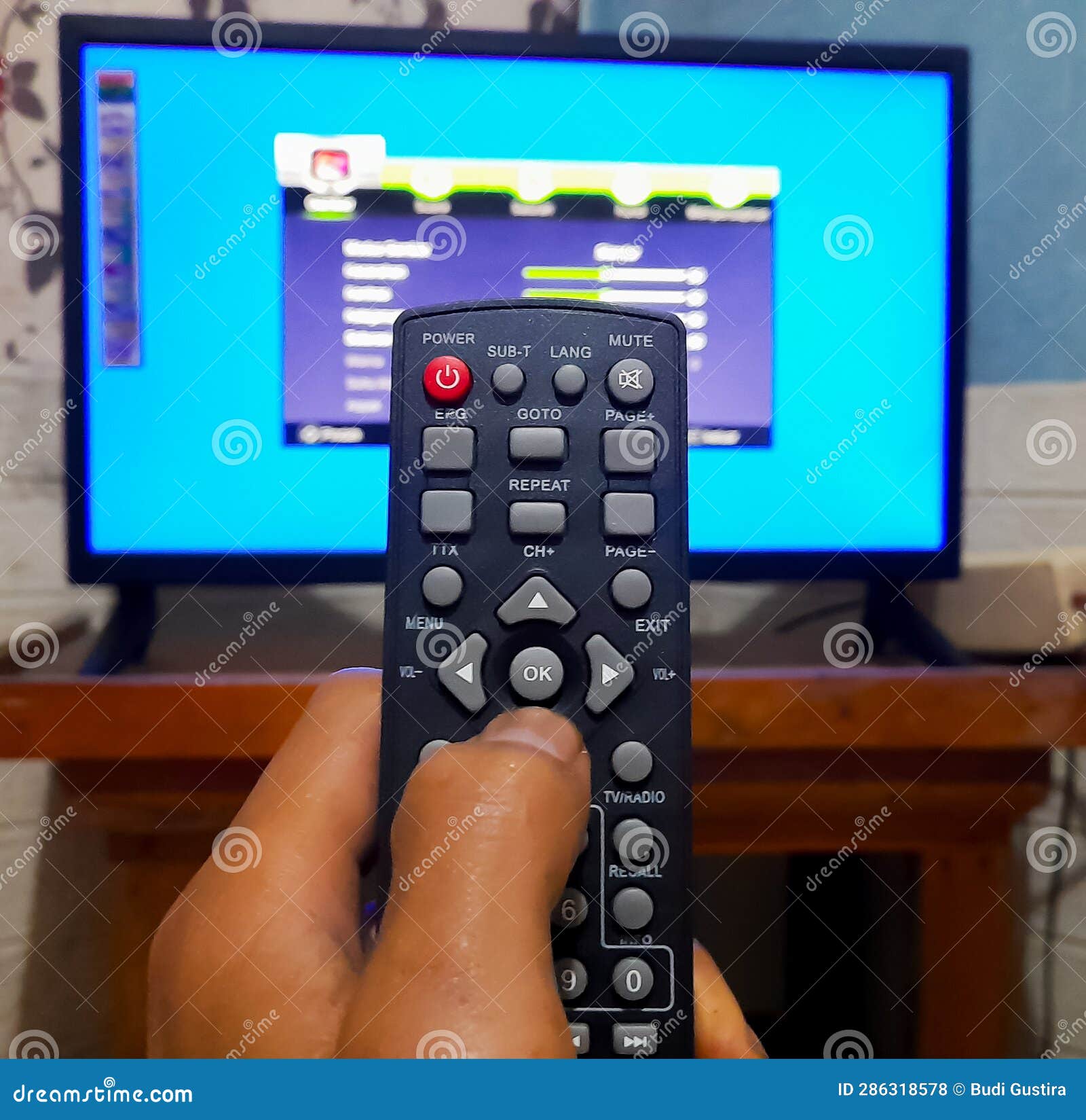 Hand Holding Remote Control Stock Photo Image of light, multimedia