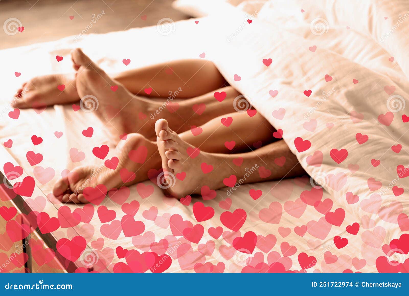 Illustration of Hearts and Passionate Young Couple Having Sex on Bed at Home, Closeup of Legs Stock Photo