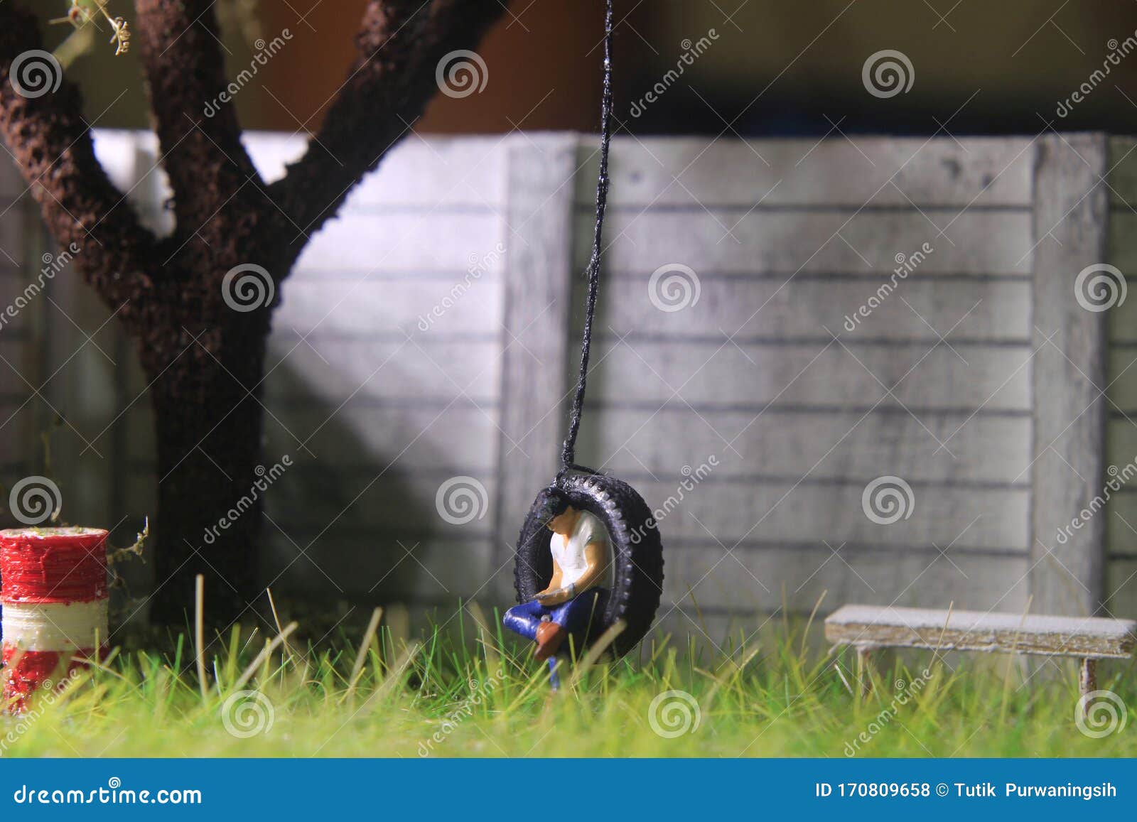 Illustration Photo, Gadget Freak or Addicted, Sitting Man Holding  Smartphone at Swinging from Used Car Tire in the Yard Stock Photo - Image  of mini, figurine: 170809658