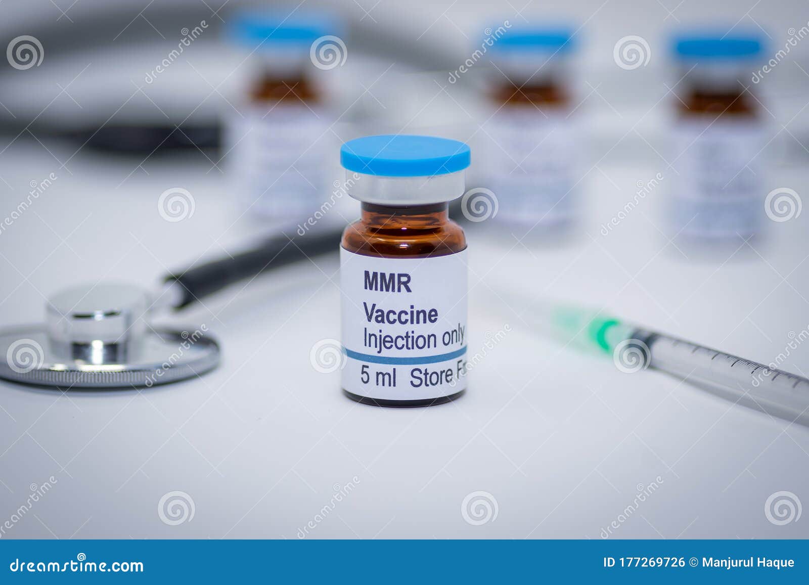 illustrative picture of measles mumps and rubella mmr vaccine vial with syringe and stethoscope