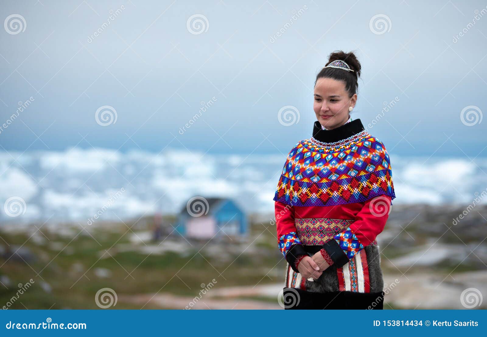 Young Inuit Woman in Traditional Clothing Posing for Photos in a Small ...