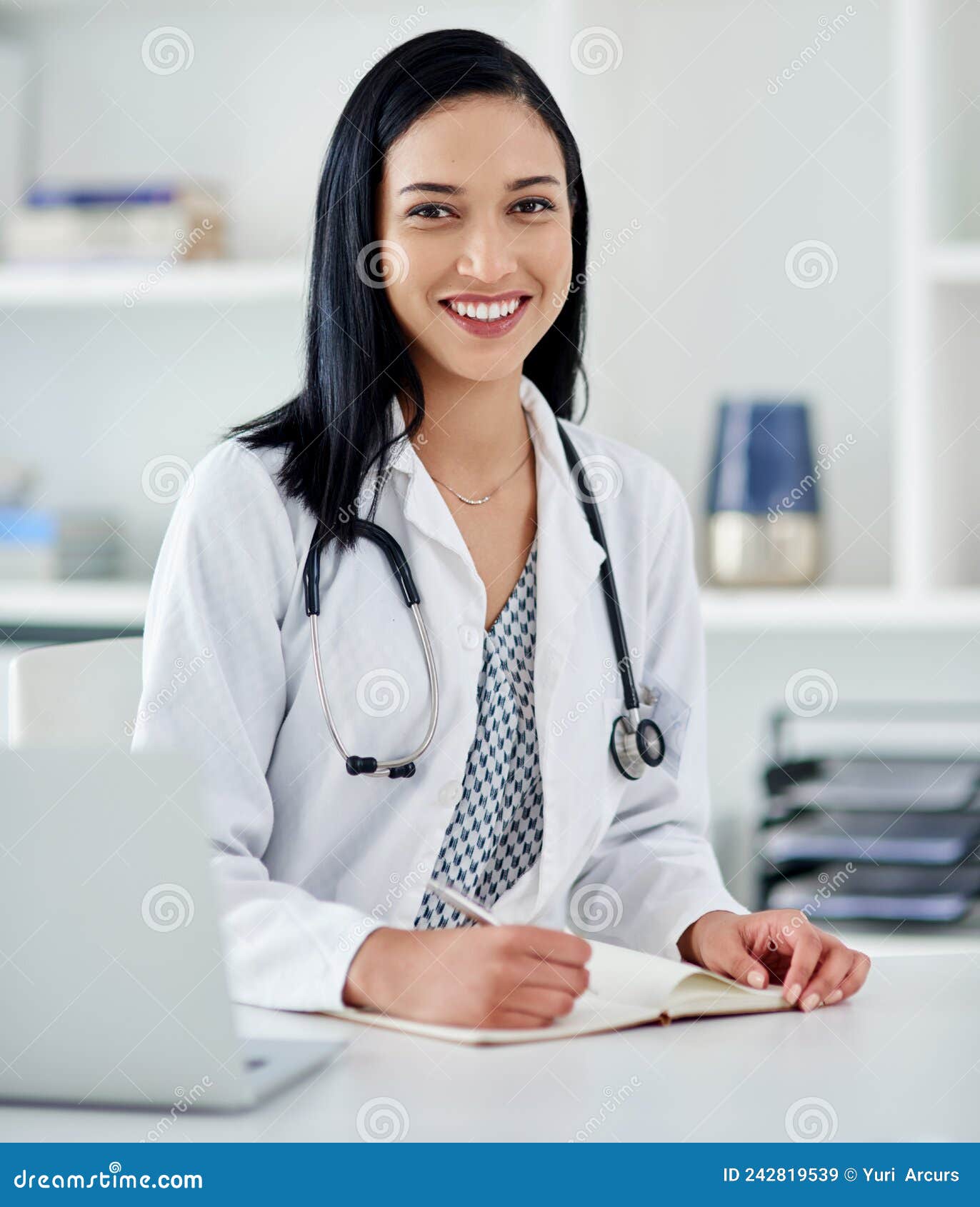 Im Giving You a Clean Bill of Health. Shot of a Young Doctor Writing in ...
