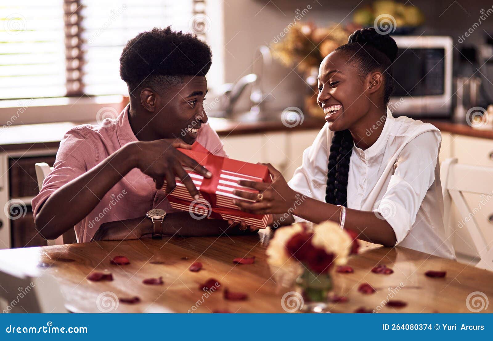 Im Sure Youll Love this. an Affectionate Young Man Giving His Wife a