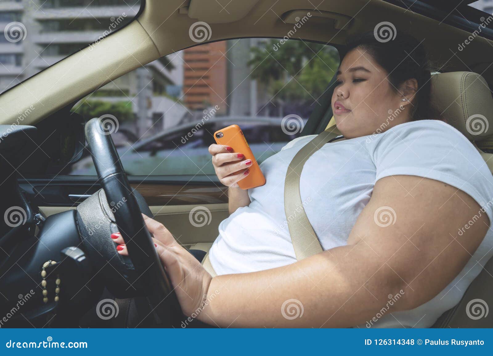 Asian Obese Woman Runs From Fast Food Offered Royalty Free Stock Image