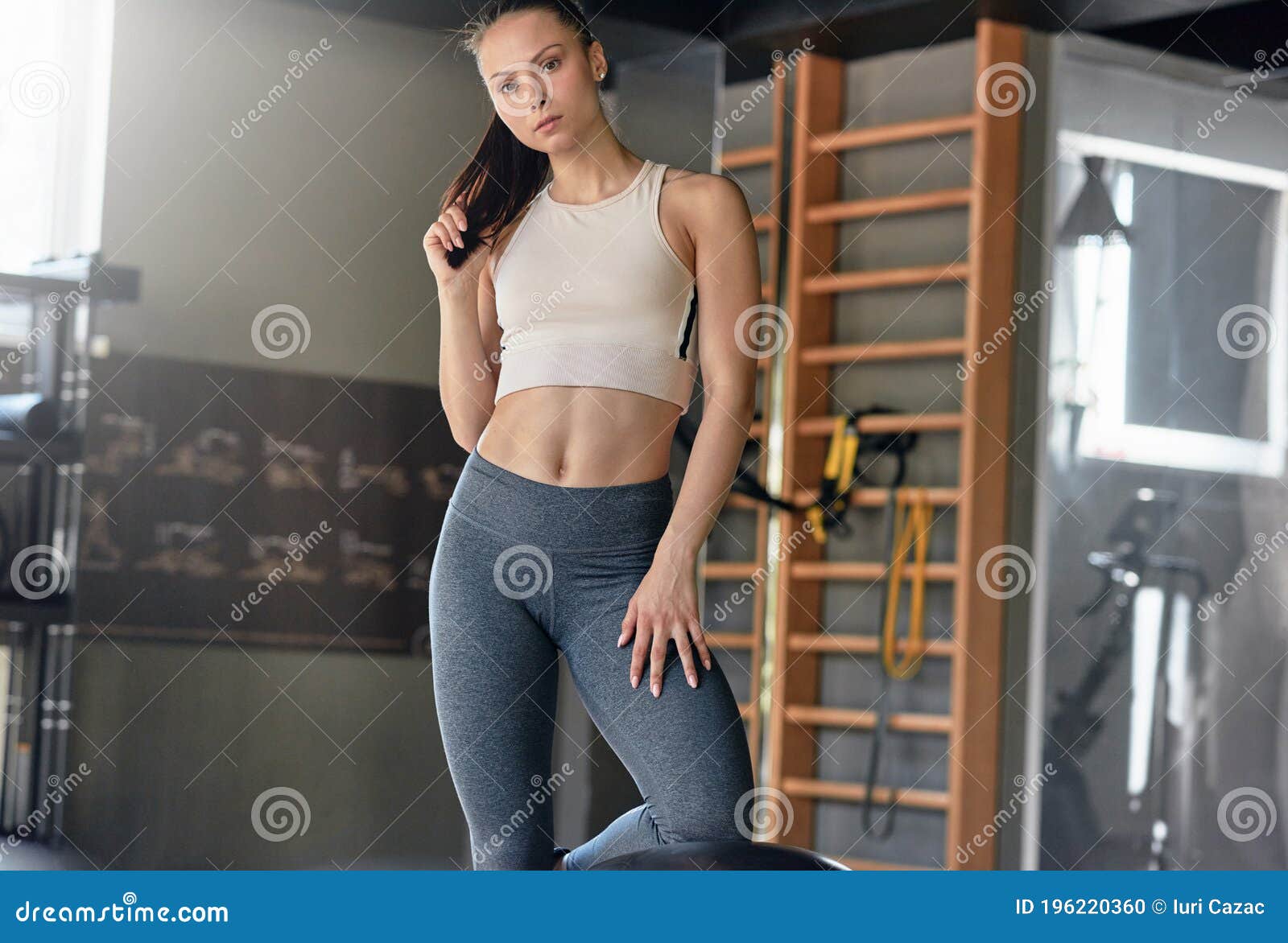 Fit Female Athlete In Activewear Ready To Doing Exercise With