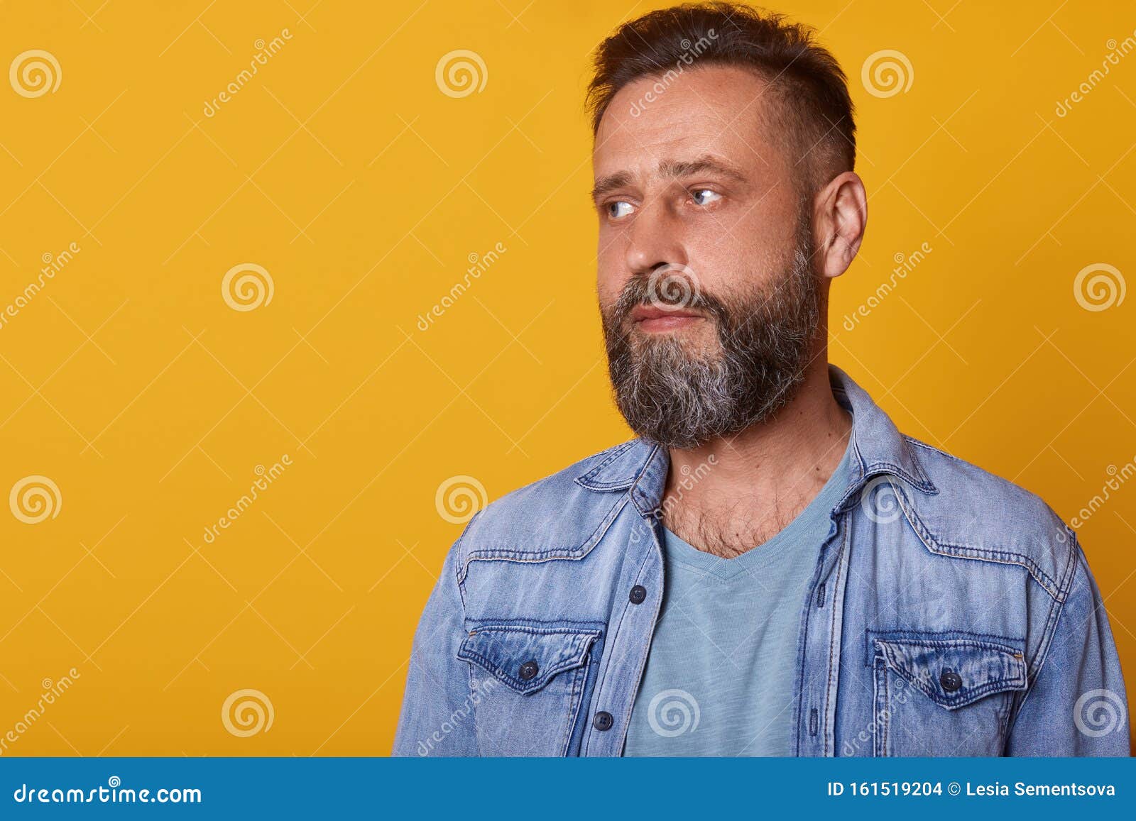 Image of Bearded Young Man with Calm Facial Expression, Looking Aside ...