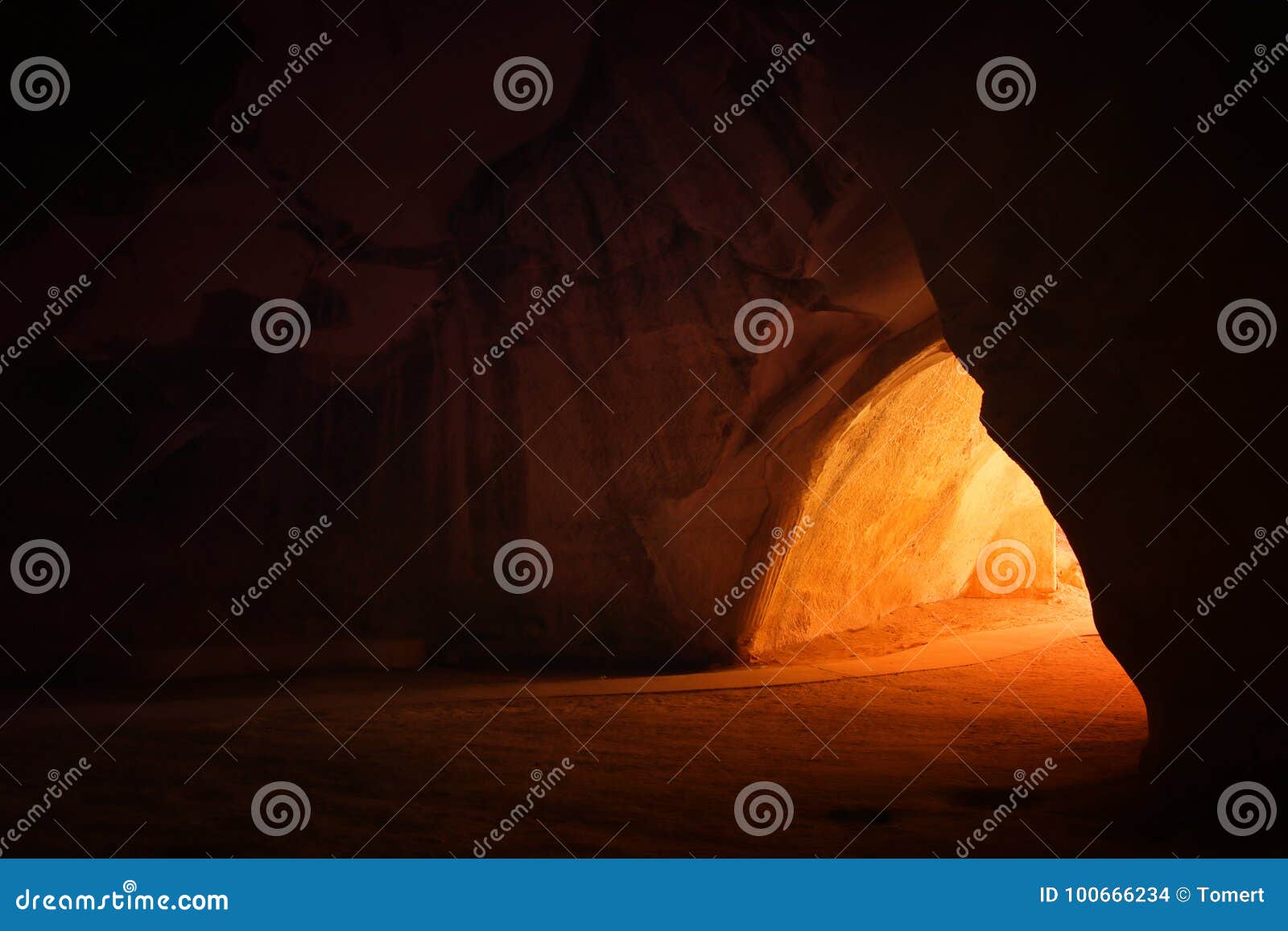 image of beautiful golden light through the cave entrance