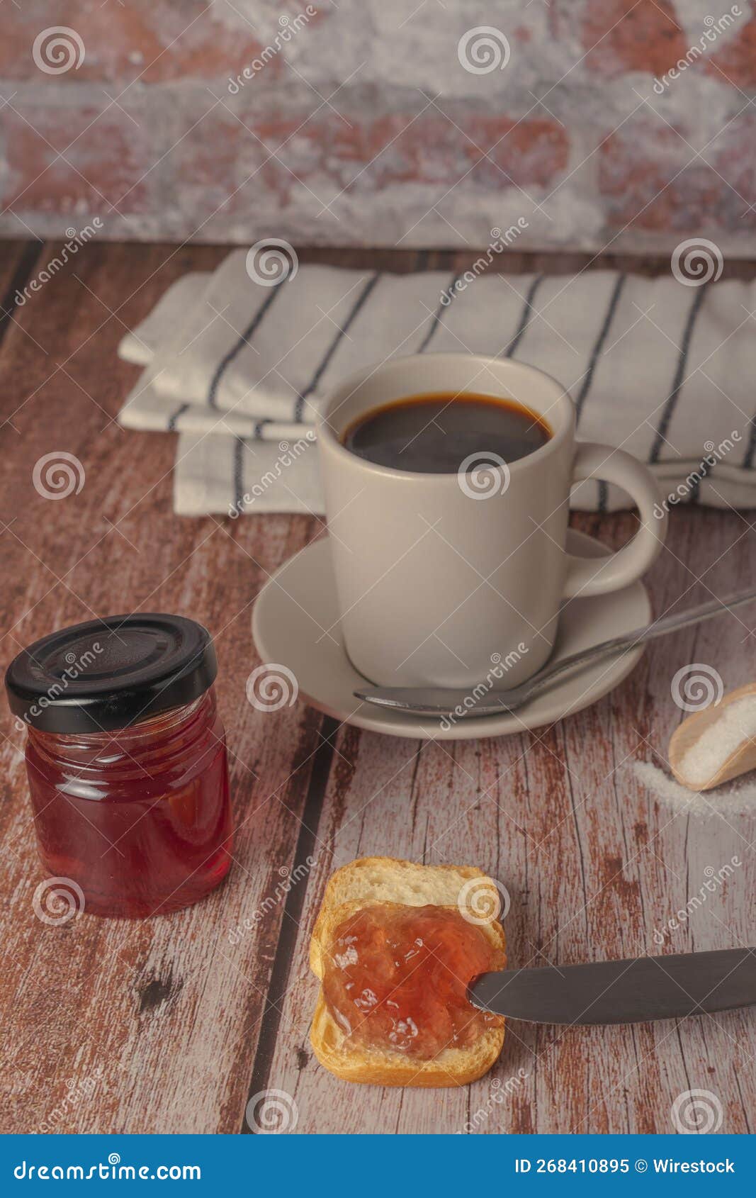 This is an Image of a Breakfast with Bread, Jam and Coffee Stock Image
