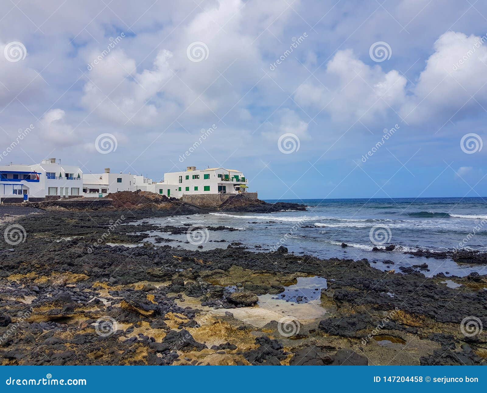 image of buildings on the coast and the sea in arrieta. lanzarote, spain