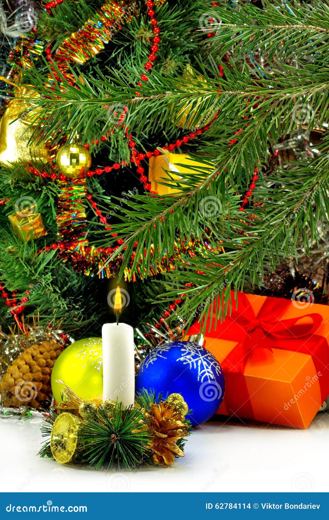Image of a Burning Candle on the Christmas Tree Background Closeup