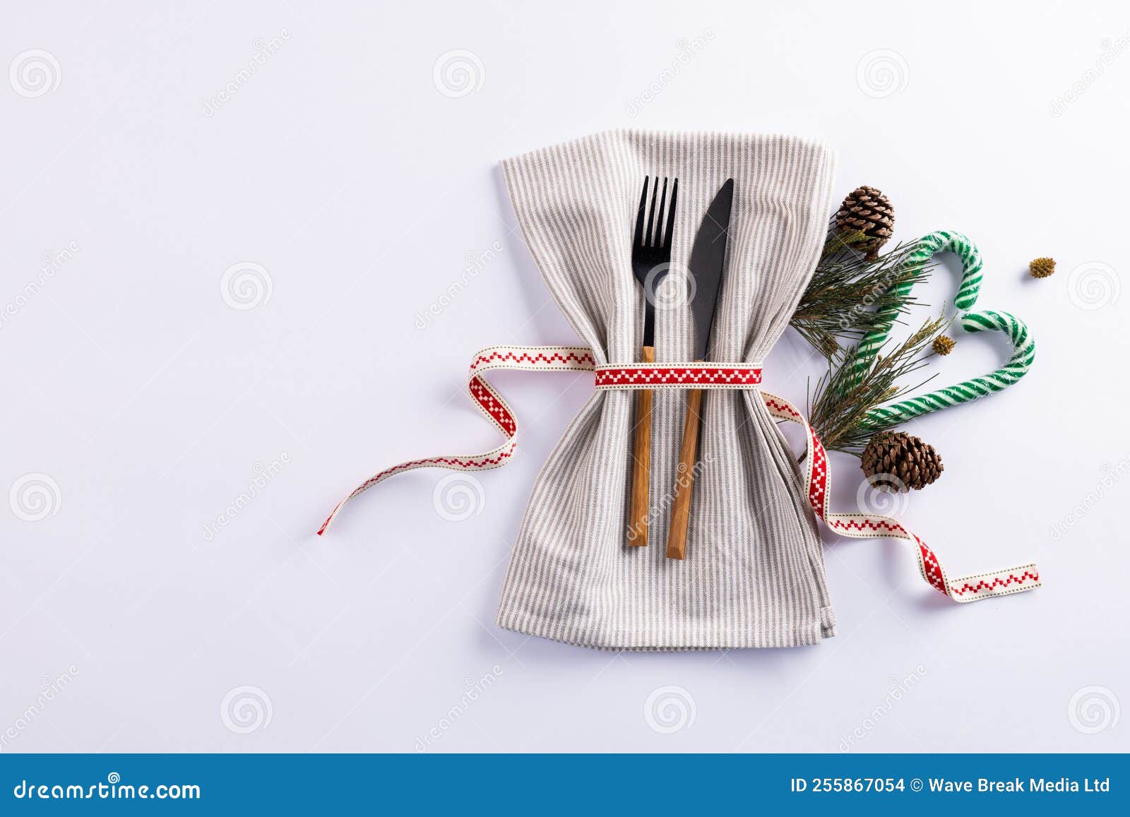 Image Of Christmas Place Setting With Cutlery And Copy Space On White image-of-christmas-place-setting-with-cutlery-and-copy-space-on-white
