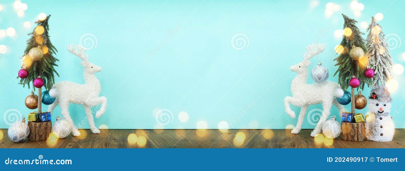 Image of Christmas Tree with Decorations and White Deer in Front of