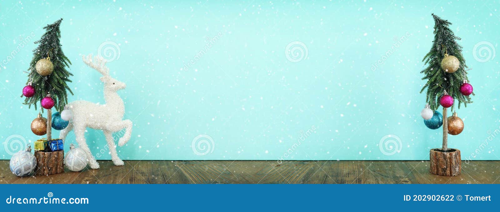 Image of Christmas Tree with Decorations and White Deer in Front of