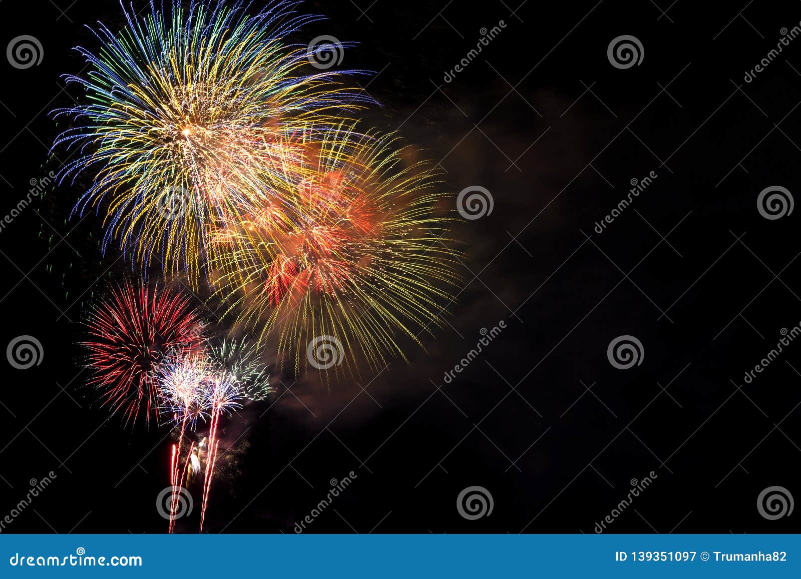 fireworks bursting in night sky with copyspace