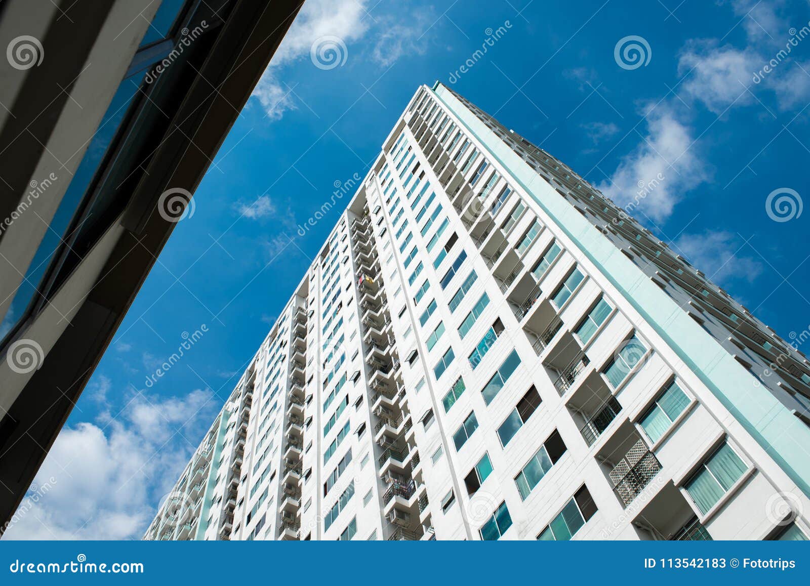 Image of Condo Building and Blue Sky Background. Stock Image Image of